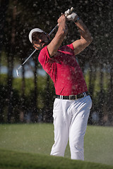 Image showing golfer hitting a sand bunker shot