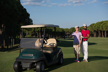 Image showing couple in buggy on golf course