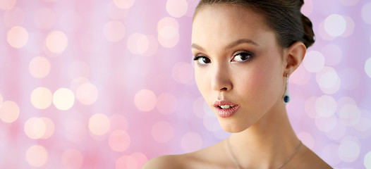 Image showing close up of beautiful woman face with earring