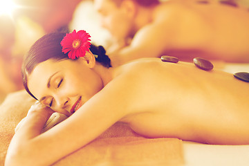 Image showing couple in spa with hot stones