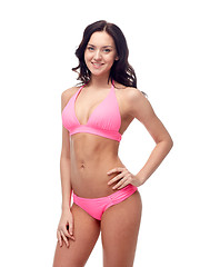 Image showing happy young woman in pink bikini swimsuit