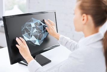 Image showing businesswoman with projection on computer