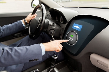 Image showing close up of man in car with starter on computer