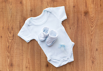 Image showing close up of baby boys clothes for newborn on table