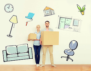 Image showing couple with cardboard boxes moving to new home