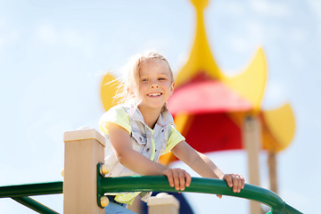 Image showing happy little girl climbing on children playground