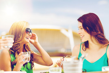 Image showing girls in cafe on the beach