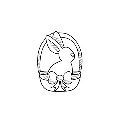 Image showing Easter bunny sitting in basket sketch icon.