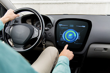 Image showing man driving car with eco mode on board computer