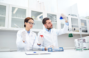 Image showing young scientists making test or research in lab