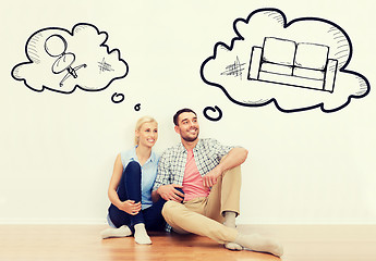 Image showing happy couple of man and woman moving to new home