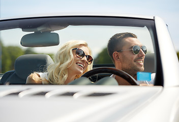 Image showing happy man and woman driving in cabriolet car