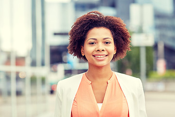 Image showing happy young african american businesswoman in city