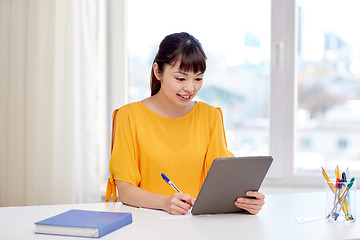 Image showing asian woman student with tablet pc at home