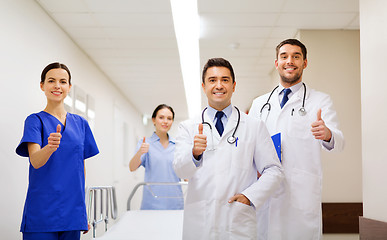 Image showing happy doctors showing thumbs up at hospital