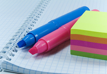 Image showing two colored markers and notes