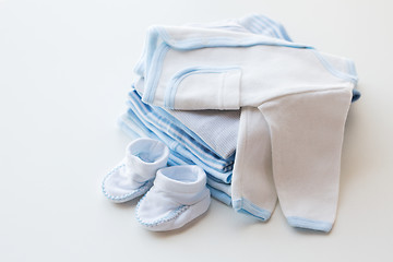 Image showing close up of baby boys clothes for newborn on table