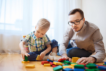 Image showing father and son playing with toy blocks at home