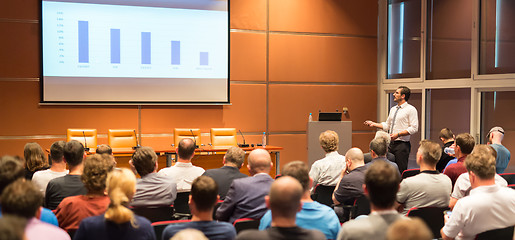 Image showing Business speaker giving a talk in conference hall.