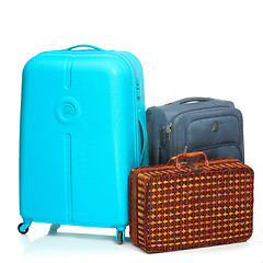 Image showing The modern and retro suitcases on white background