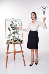Image showing The young business woman showing idea on the white background