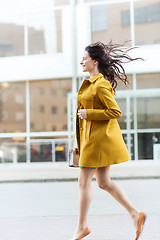 Image showing happy young woman or teenage girl on city street