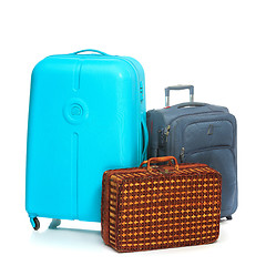 Image showing The modern and retro suitcases on white background