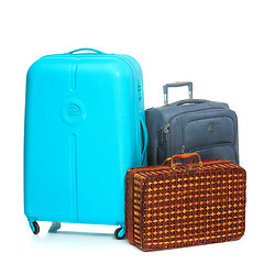 Image showing The modern and retro suitcases on white background