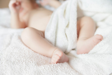 Image showing newborn tiny baby lying on the bed with blanket