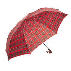 Image showing The checkered umbrella isolated against white background