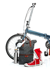 Image showing The new modern bicycle and suitcase, sneakers, thermos