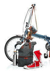 Image showing The new modern bicycle and suitcase, sneakers, thermos