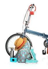 Image showing The new modern bicycle and suitcase, sneakers, thermos