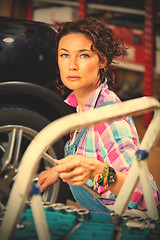 Image showing Portrait of a woman mechanic in overalls