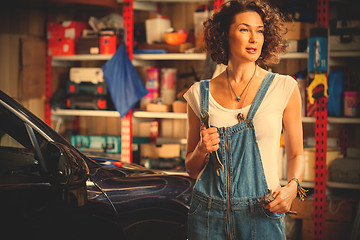 Image showing woman mechanic with a wrench in his hand