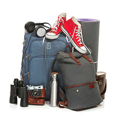 Image showing The suitcases, sneakers, retro camera, karrimat and binoculars on white background.