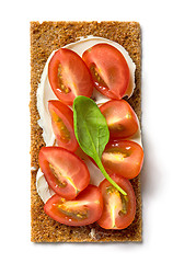 Image showing crispbread with cream cheese and tomato pieces