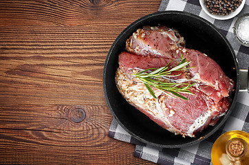 Image showing raw marinated meat on cooking pan