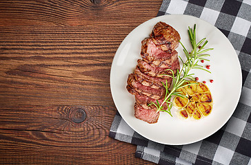 Image showing grilled steak on white plate