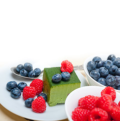 Image showing green tea matcha mousse cake with berries