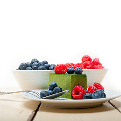 Image showing green tea matcha mousse cake with berries