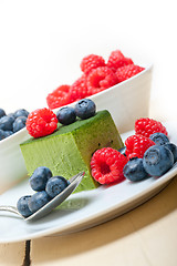 Image showing green tea matcha mousse cake with berries