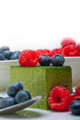 Image showing green tea matcha mousse cake with berries