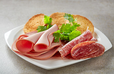 Image showing various sausages on white plate