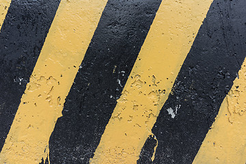 Image showing Yellow and black concrete barrier