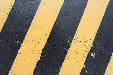 Image showing Yellow and black concrete barrier