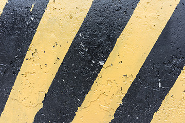 Image showing Yellow and black concrete barrier