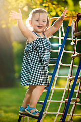 Image showing The little baby girl playing at outdoor playground