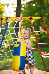 Image showing The little baby girl playing at outdoor playground