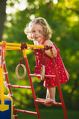 Image showing The little baby girl playing at outdoor playground